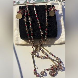 set of dangling earrings and necklace.